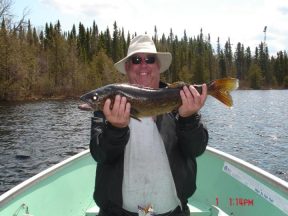 Terry holding Walleye caught at Flindt Landing Camp